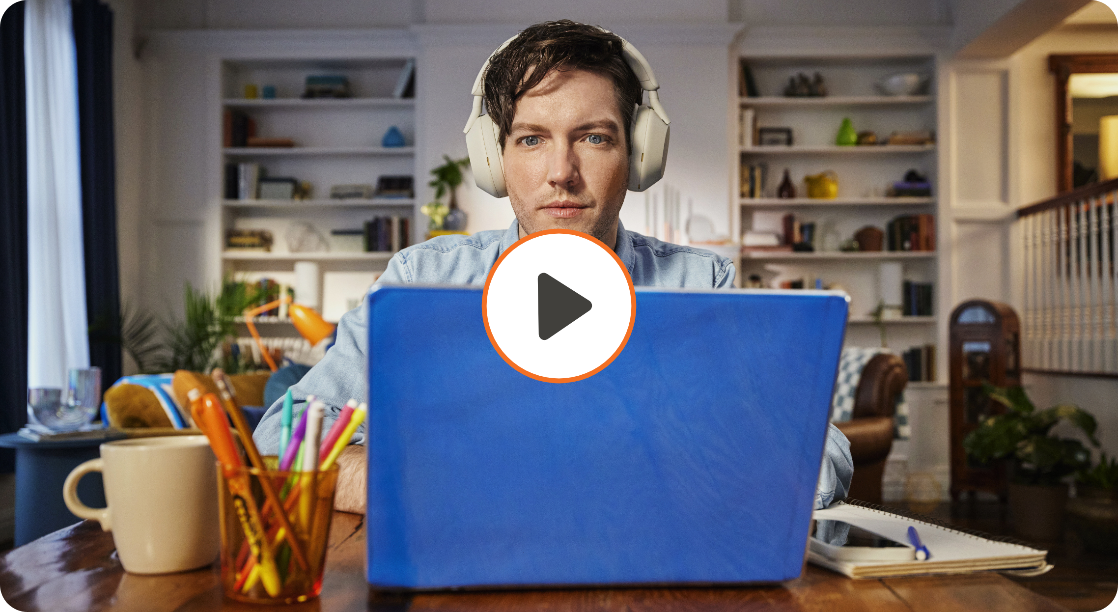 Video thumbnail of man wearing headphones using laptop