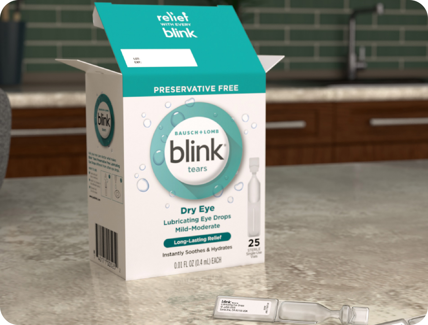 Single-use vial of Blink Tears Preservative Free lies on a counter next to its opened package