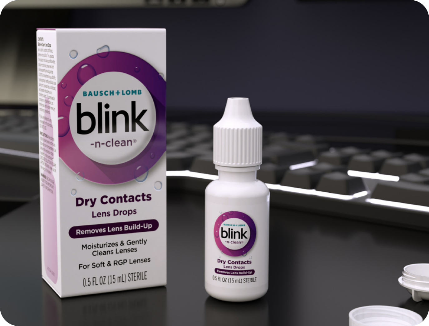 Blink-N-Clean Lens Drops bottle and package on a desk in front of a keyboard