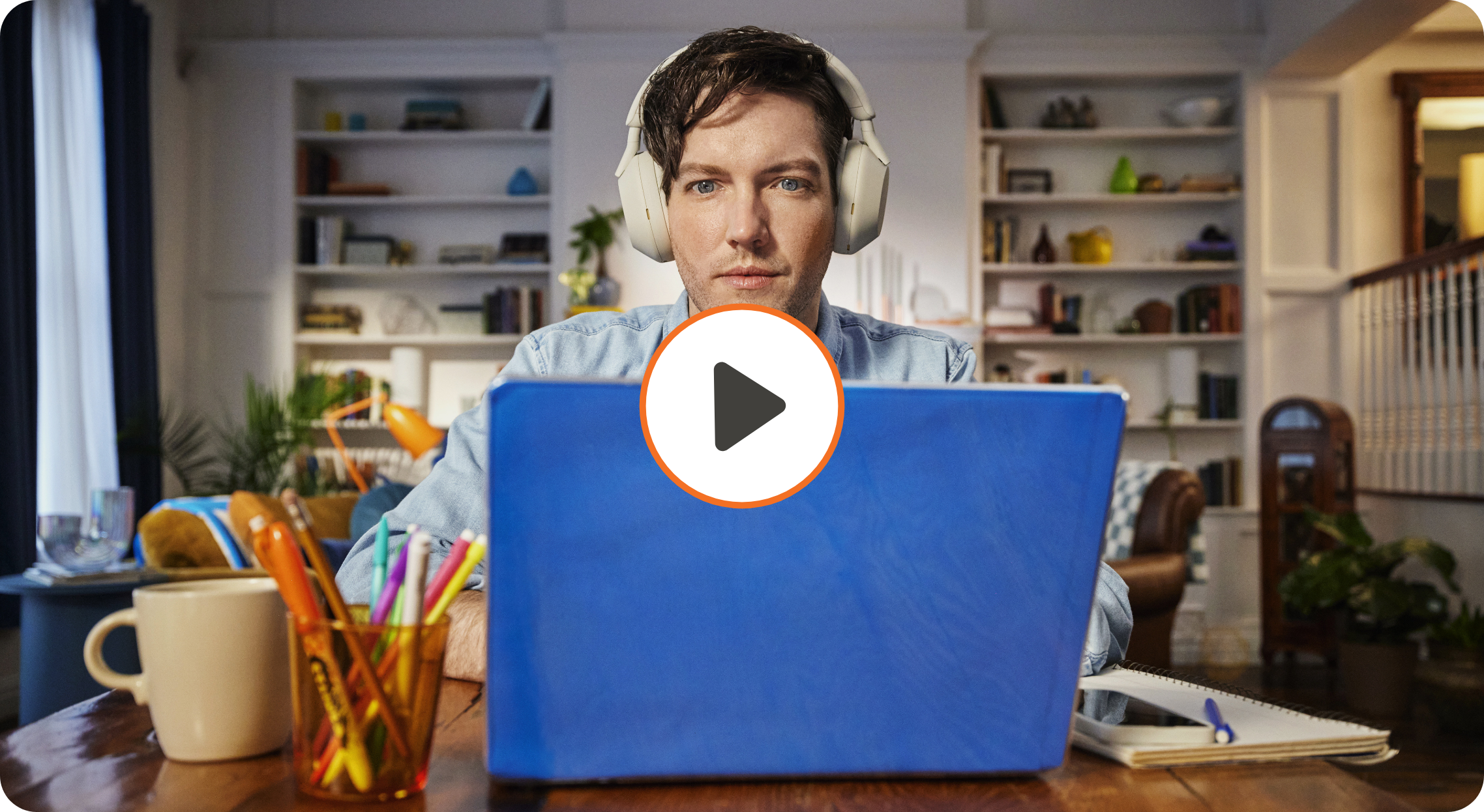 Video thumbnail of man wearing headphones using laptop